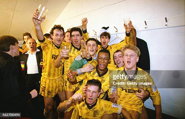 Sutton United players including goalscorers Tony Rains and Matthew Hanlan celebrate in the dressing room after the FA Cup 3rd Round match between...