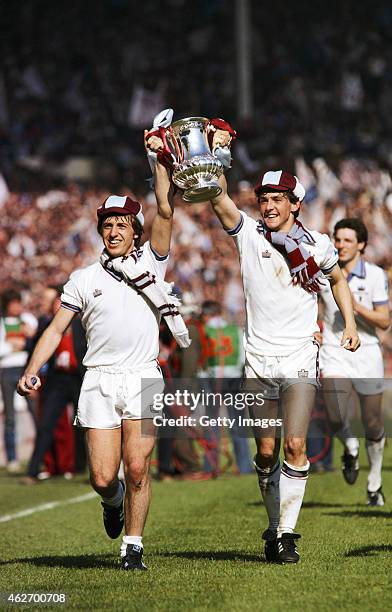 West Ham United players Geoff Pike and Paul Allen parade the cup after beating Arsenal 1-0 in the 1980 FA Cup Final at Wembley Stadium on May 10,...