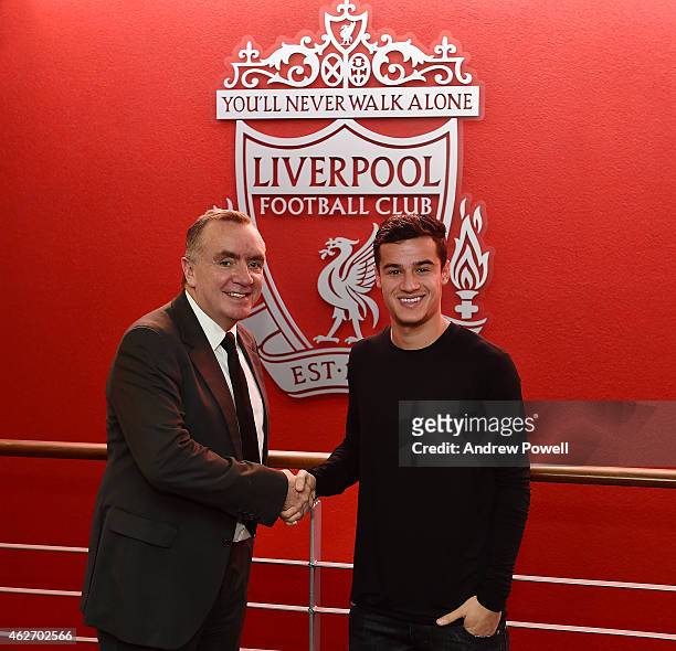 Philippe Coutinho shakes hands with Ian Ayre managing director after signing a new contract to stay at Liverpool, at Melwood Training Ground on...