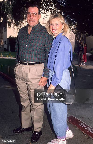 Actor John Schuck and girlfriend Harrison Houle attend the "Oliver & Company" Burbank Premiere on November 6, 1988 at Studio Theatre, Walt Disney...