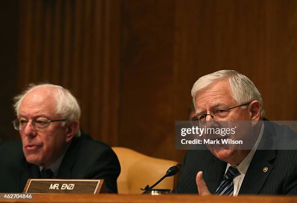 Chairman Michael Enzi speaks while flanked by Sen. Bernie Sanders during a Senate Budget Committee hearing on Capitol Hill, February 3, 2015 in...