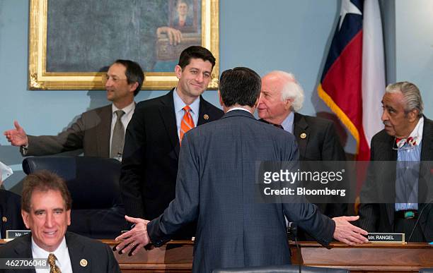 Jacob "Jack Lew, U.S. Treasury secretary, center, talks to Representative Paul Ryan, a Republican from Wisconsin and chairman of the House Ways and...
