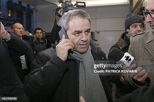 Xavier Bertrand a member of the Union for a Popular Movement right-wing opposition party, speaks on the phone as he arrives at the party's...