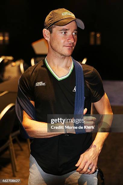French cyclist Thomas Voeckler of Team Europcar speaks to media at a press conference with his shoulder in a sling after he broke his collar bone on...