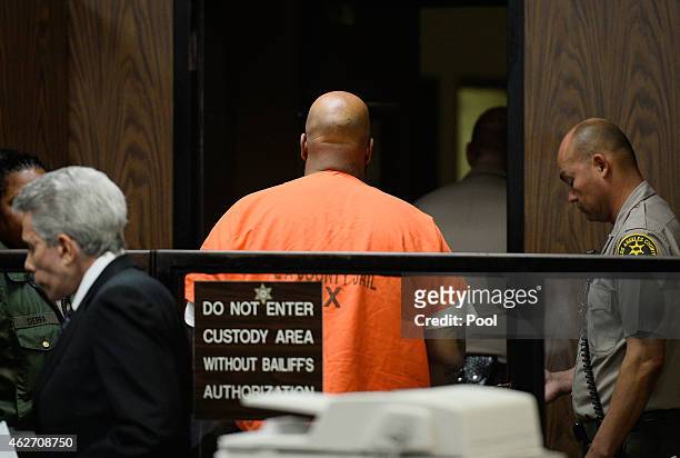 Marian "Suge" Kinght and his Lawyer David E Kenner appear at his arraignmet at Compton Courthouse on February 3, 2015 in Compton, California. Knight...