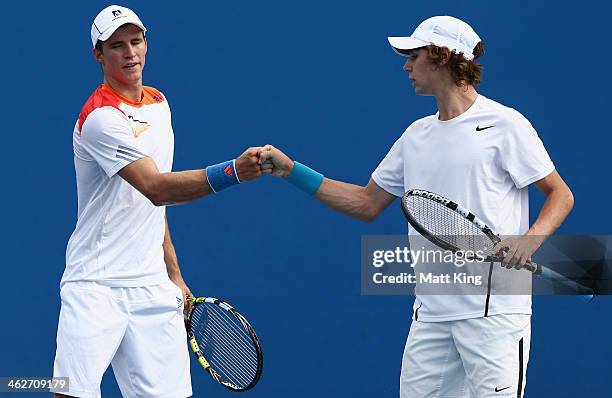 Benjamin Mitchell of Australia and Jordan Thompson of Australia talk tactics in their first round doubles match against Carlos Berlocq of Argentina...