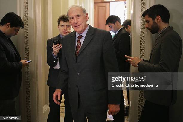 Sen. Dan Coats talks with reporters before heading into the weekly GOP policy luncheon at the U.S. Capitol February 3, 2015 in Washington, DC....