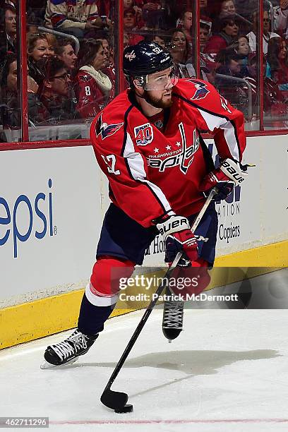 Mike Green of the Washington Capitals controls the puck against the St. Louis Blues in the first period during an NHL game at Verizon Center on...