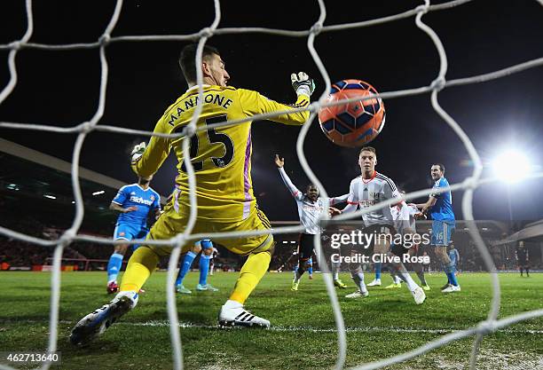 Hugo Rodallega of Fulham scores the opening goal past Vito Mannone of Sunderland during the FA Cup Fourth Round Replay match between Fulham and...