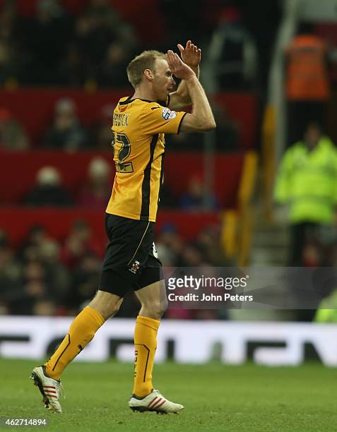 Luke Chadwick of Cambridge United applauds the fans after being substituted during the FA Cup Fourth Round replay between Manchester United and...