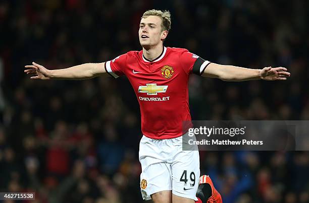 James Wilson of Manchester United celebrates scoring their third goal during the FA Cup Fourth Round replay match between Manchester United and...