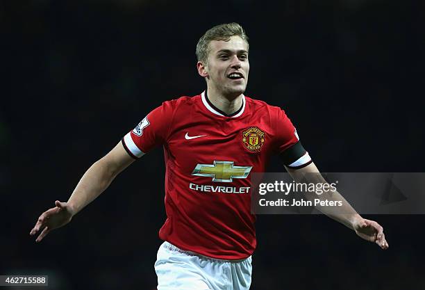 James Wilson of Manchester United celebrates scoring their third goal during the FA Cup Fourth Round replay between Manchester United and Cambridge...