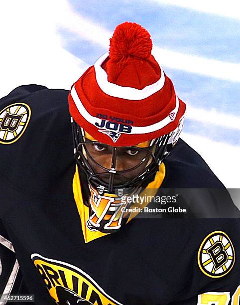 Bruins goalie Malcolm Subban wears a Patriots winter hat as he and his teammates found a way to cheer on the Patriots, who were playing the next day...
