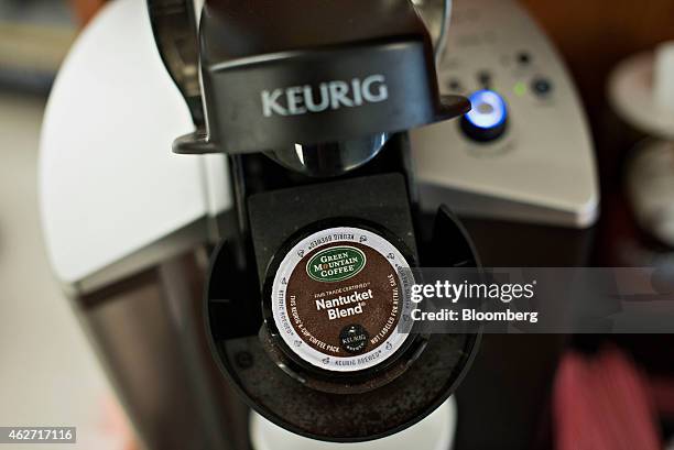 Cup coffee pack sits in a Keurig Green Mountain Inc. Machine in this arranged photograph taken at a retail store in Princeton, Illinois, U.S., on...