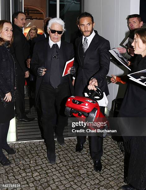 Karl Lagerfeld sighted leaving the 'Corsa Karl Und Choupette' Vernissage event on February 3, 2015 in Berlin, Germany.
