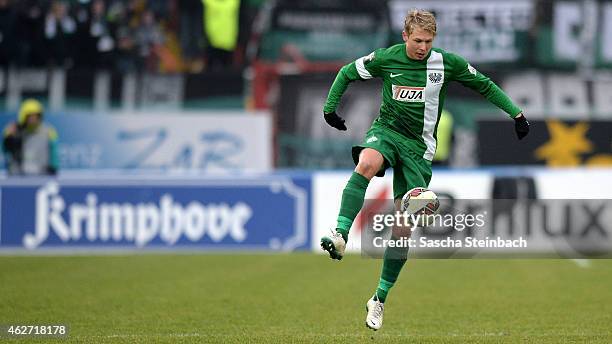 Kevin Schoeneberg of Muenster controls the ball during the 3. Liga match between Preussen Muenster and Dynamo Dresden at Preussenstadion on February...