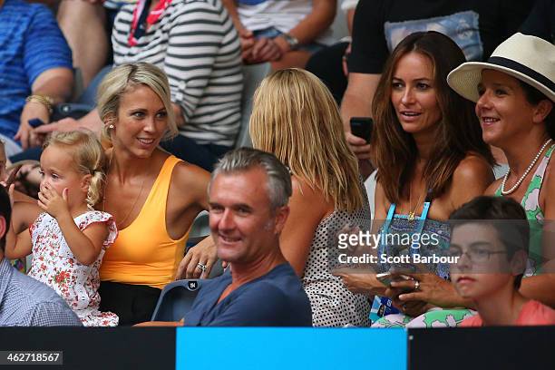 Bec Hewitt, wife of Lleyton Hewitt of Australia, with Lara Feltham, wife of Pat Rafter of Australia watch the first round men's doubles match between...
