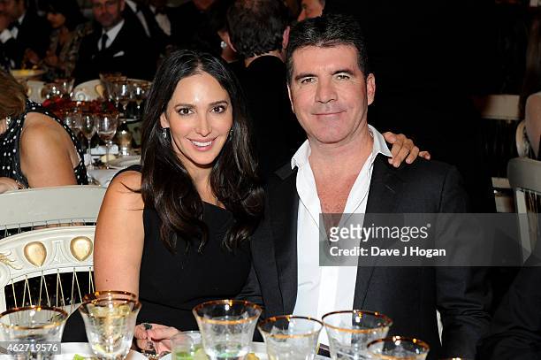 Simon Cowell and Lauren Silverman attend the British Asian Trust dinner at Banqueting House on February 3, 2015 in London, England.