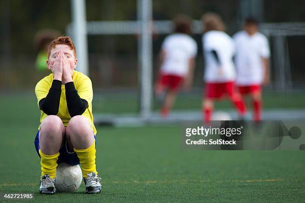 sitting on a soccer ball - club football stock pictures, royalty-free photos & images