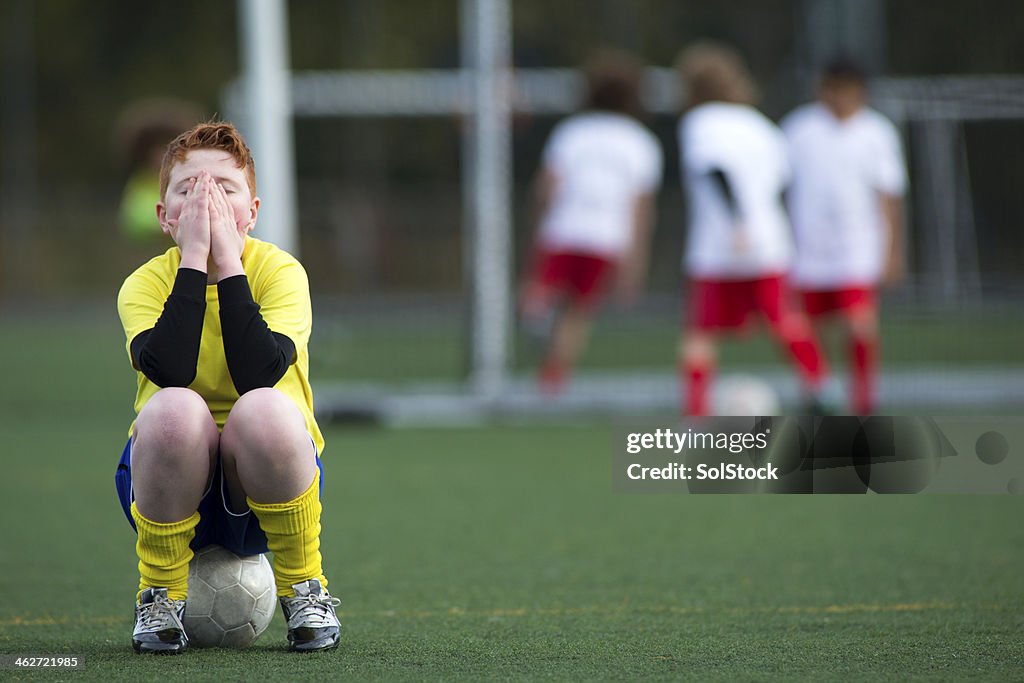 Sitting on a soccer ball