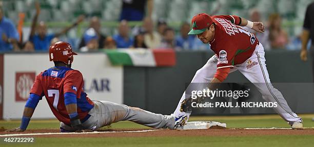 Puerto Rican National baseball team player beats the throw to Mexican National third baseman Oscar Robles in the second inning of the San Juan Serie...