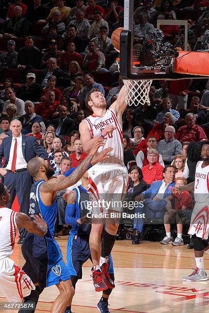 Donatas Motiejunas of the Houston Rockets shoots against the Dallas Mavericks on January 28, 2015 at the Toyota Center in Houston, Texas. NOTE TO...