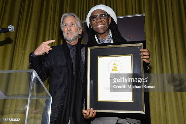 Honoree Nile Rodgers accepts the Recording Academy's President's Merit Award from National Academy of Recording Arts and Sciences President Neil...