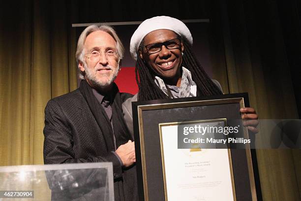 Honoree Nile Rodgers accepts the Recording Academy's President's Merit Award from National Academy of Recording Arts and Sciences President Neil...