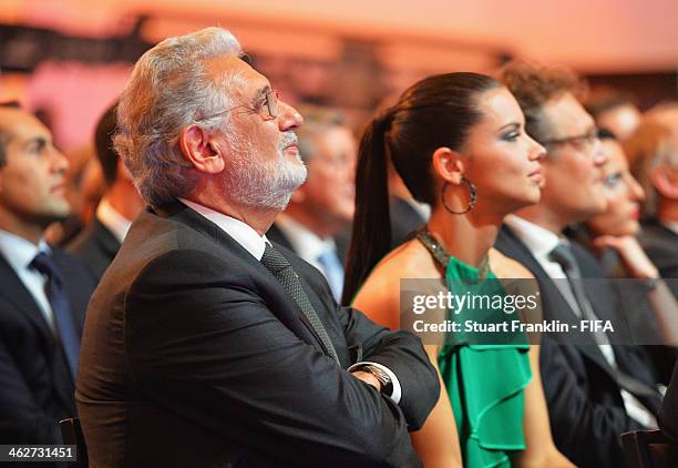 Singer Placido Domingo and model Adriana Lima watch during the FIFA Ballon d'Or Gala 2013 at the Kongresshaus on January 13, 2014 in Zurich,...