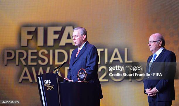 Former International Olympic Committee president Jacques Rogge collects his FIFA Presidential Award from FIFA President Joseph S. Blatter during the...