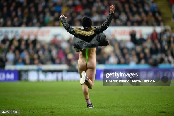 Pitch invader dressed in a Borat style mankini during the Barclays Premier League match between Newcastle United and Manchester City at St James'...