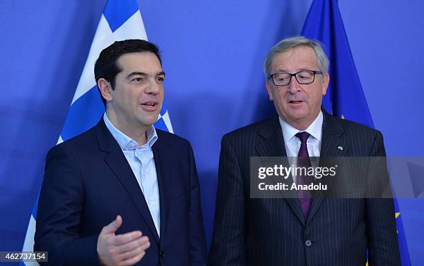 Greek Prime Minister Alexis Tsipras meets European Commission President Jean-Claude Juncker at the European Commission headquarters in Brussels on...