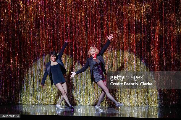 Carly Hughes and Jennifer Nettles appear on stage during their debut as Velma Kelley and Roxie Hart in the Broadway musical "Chicago" at the...