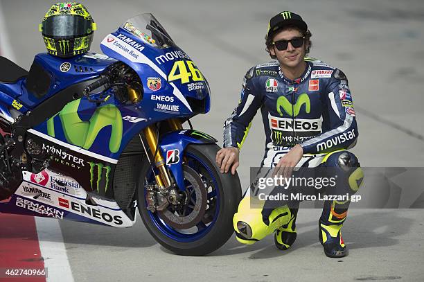 Valentino Rossi of Italy and Movistar Yamaha MotoGP poses with his bike in pit during day one of the MotoGP tests at Sepang Circuit on February 4,...