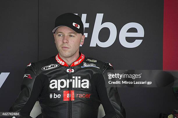 Michael Laverty of Great Britain and Aprilia Test Team looks on in box during day one of the MotoGP tests at Sepang Circuit on February 4, 2015 in...