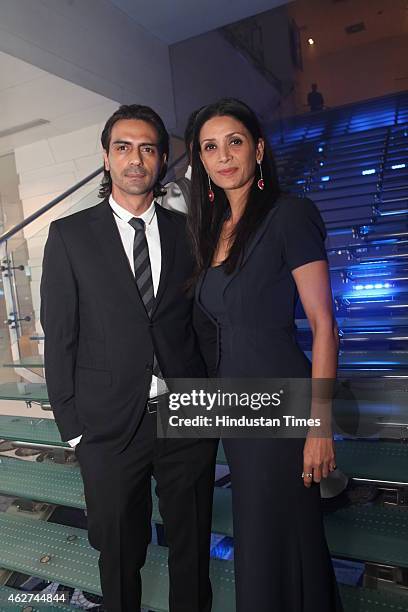 Bollywood actor Arjun Rampal with wife Mehr Jesia Rampal during India Art Fair closing party at Le Meridien on February 1, 2015 in New Delhi, India.