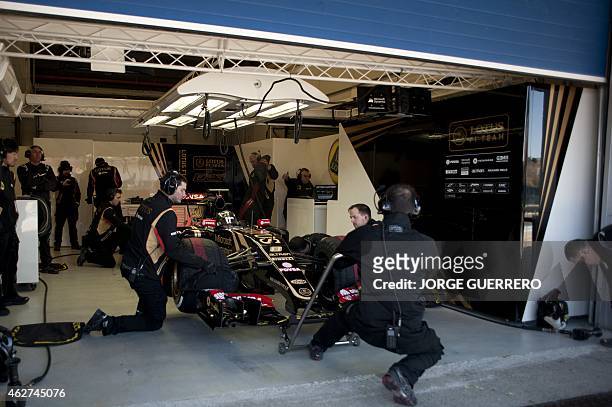 Lotus F1 Team's French driver Romain Grosjean sits in his car during the fourth day of the Formula One pre-season tests at Jerez racetrack in Jerez...