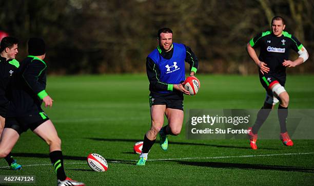 Wales player Jamie Roberts runs with the ball during the Wales open training session ahead of friday's 6 Nations match against England at the Vale...