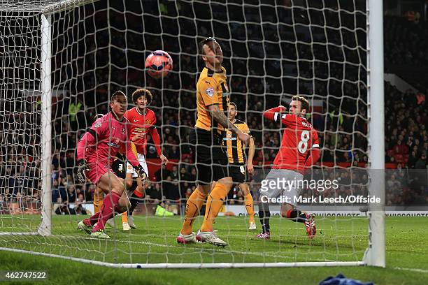 Juan Mata of Man Utd scores their 1st goal during the FA Cup Fourth Round Replay match between Manchester United and Cambridge United at Old Trafford...