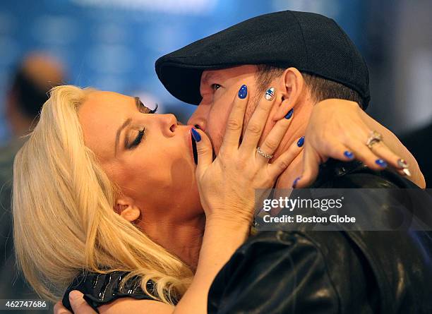 Jenny McCarthy and her husband Donnie Wahlberg demonstrate the virgin contenstant's kiss on the television show 'The Bachelor' before McCarty's...