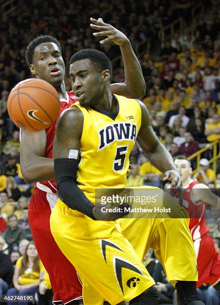 Forward Nigel Hayes of the Wisconsin Badgers battles for a rebound with guard Anthony Clemmons of the Iowa Hawkeyes, in the second half on January...