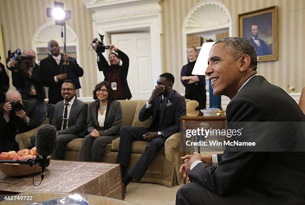 President Barack Obama meets with a group of 'DREAMers' who have received Deferred Action for Childhood Arrivals in the Oval Office of the White...