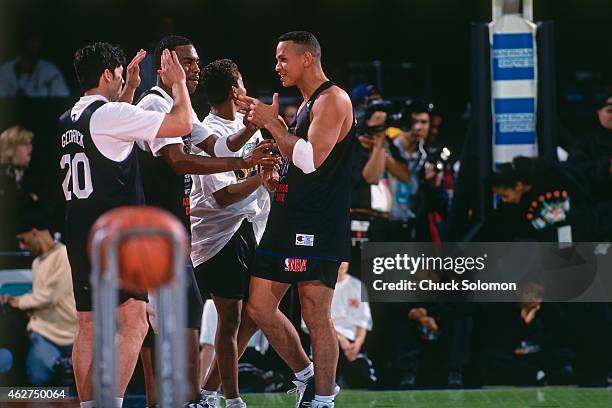 Alex Rodriguez of the Seattle Mariners greets teammates during the Celebrity Game as part of All Star Weekend on February 7, 1998 at Madison Square...