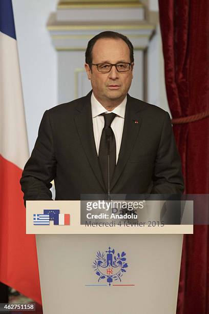 French president Francois Hollande holds a press conference after meeting Greece's Prime Minister Alexis Tsipras at the Elysee presidential palace,...