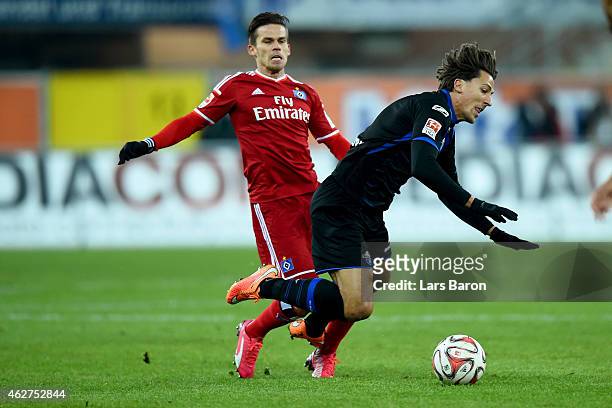 Zoltan Stieber of Hamburg battles for the ball with Jens Wemmer of Paderborn during the Bundesliga match between SC Paderborn 07 and Hamburger SV at...