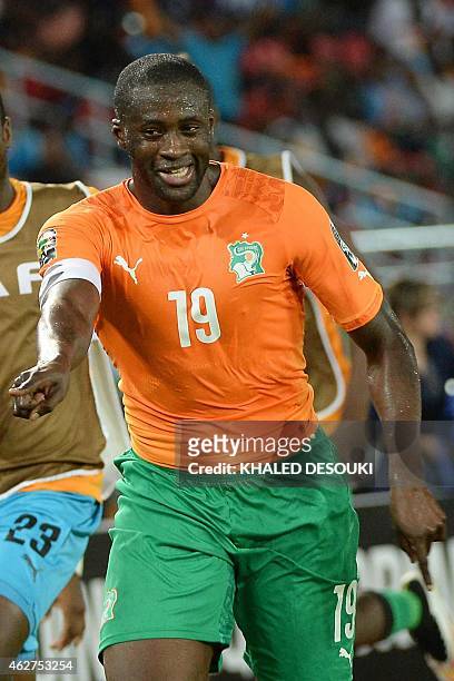 Ivory Coast's midfielder Yaya Toure celebrates after scoring a goal during the 2015 African Cup of Nations semi-final football match between...