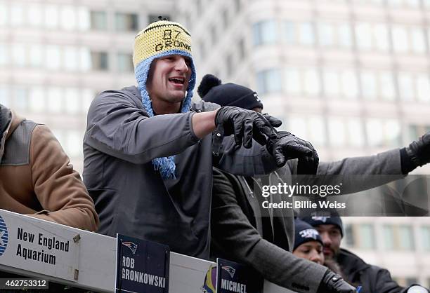 Tight end Rob Gronkowski of the New England Patriots waves to fans during a Super Bowl victory parade on February 4, 2015 in Boston, Massachusetts....