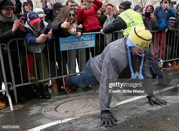 Tight end Rob Gronkowski of the New England Patriots does push ups during a Super Bowl victory parade on February 4, 2015 in Boston, Massachusetts....