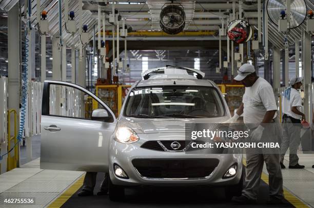 Cars get the final inspection in the assembly line of the March and Versa models at Nissan's Industrial Complex in Resende, 160 km west of Rio de...
