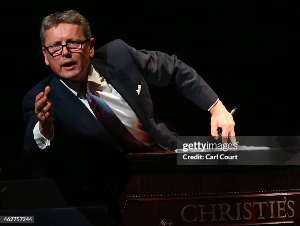 Auctioneer Jussi Pylkkanen gestures during the Impressionist and Modern Evening Art Sale at Christies on February 04, 2015 in London, England....